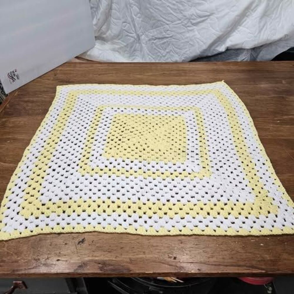 Handmade white and yellow crochet granny square blanket